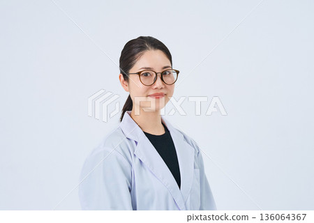 A young lady in a white suit 136064367