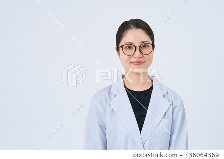 A young lady in a white suit A young lady in a white suit 136064369