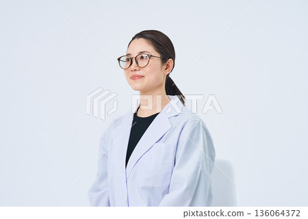 A young lady in a white suit 136064372