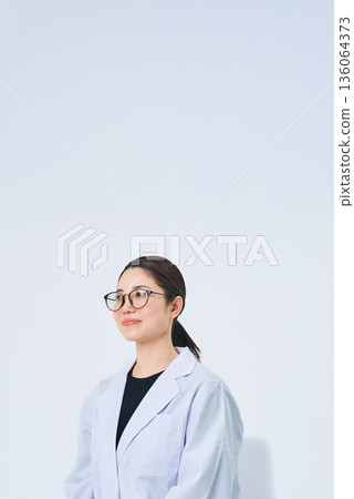 A young lady in a white suit A young lady in a white suit 136064373