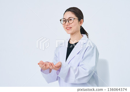 A young lady in a white suit 136064374