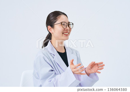 A young lady in a white suit A young lady in a white suit 136064380