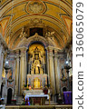 Baroque church interior with gilded altar ornate nave columns arches and ceiling fresco Lisbon Portugal. High quality photo 136065079