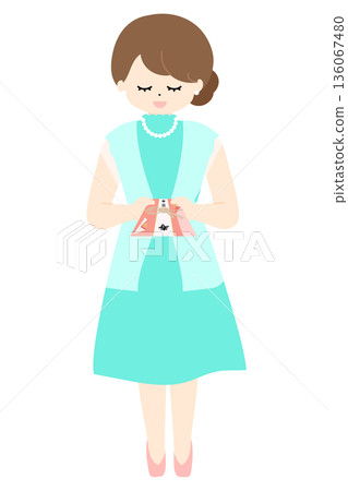 婚禮上，一位女士遞上一個禮物信封。 136067480