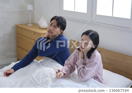Couple waking up tired 136067594
