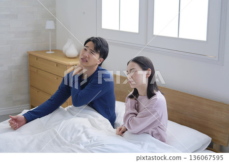 Couple waking up tired Couple waking up tired 136067595