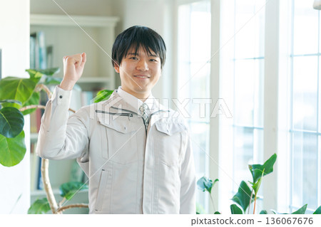 young man in work clothes young man in work clothes 136067676