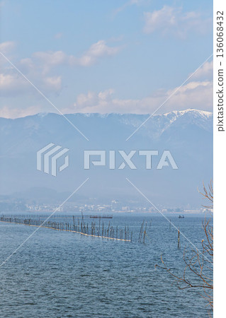 Fishing on Lake Biwa, hazy with yellow sand, and snow-covered Mount Hira Fishing on Lake Biwa, hazy with yellow sand, and snow-covered Mount Hira 136068432