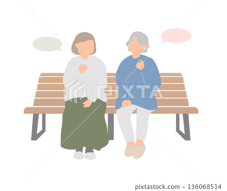 A peaceful moment of conversation between senior women on a bench A peaceful moment of conversation between senior women on a bench 136068514