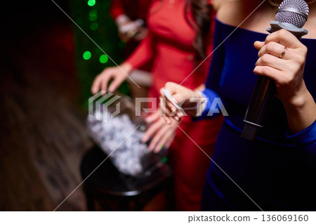 Individuals involved are dressed suitably and ready for ceremony activities, All attendees and organizers are appropriately dressed and prepared for formal gathering 136069160