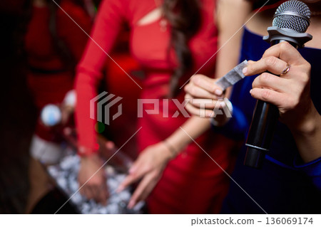 Individuals involved are dressed suitably and ready for ceremony activities, All attendees and organizers are appropriately dressed and prepared for formal gathering 136069174