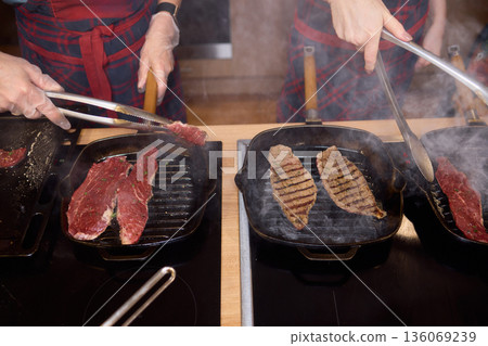 Cooking market scene, Vegetables being grilled and prepared, Vibrant outdoor kitchen with fresh vegetables, Busy market area where vegetables are expertly grilled and prepared 136069239
