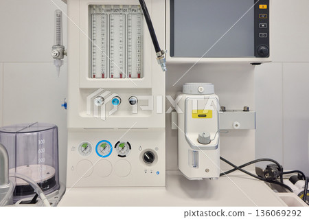 Medical infusion equipment, Clinical infusion pump with calibration features, Healthcare infusion system mounted on clean wall with adjustable flow and pressure controls Medical infusion equipment, Clinical infusion pump with calibration features, Healthcare infusion system mounted on clean wall with adjustable flow and pressure controls 136069292