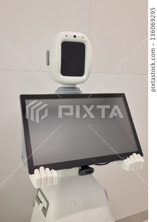 Quiet medical consultation robot, Remote healthcare robot with screen and camera setup, Hospital telepresence robot equipped for patient monitoring and interaction 136069295