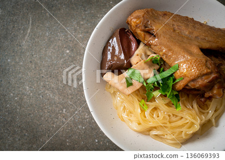 dried noodles with braised duck in white bowl dried noodles with braised duck in white bowl 136069393