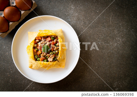 egg wrap or stuffed egg with minced pork and vegetable egg wrap or stuffed egg with minced pork and vegetable 136069398