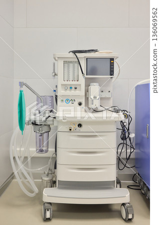 Medical infusion equipment, Clinical infusion pump with calibration features, Healthcare infusion system mounted on clean wall with adjustable flow and pressure controls Medical infusion equipment, Clinical infusion pump with calibration features, Healthcare infusion system mounted on clean wall with adjustable flow and pressure controls 136069562