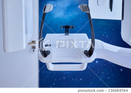 Futuristic clinic with advanced scanner, High-tech dental CT scanner in sleek clinic setting, Cutting-edge dental imaging equipment within futuristic clinic environment 136069564