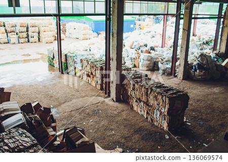 Recycle site overview. Structured recycling center with loading area and compacted waste. Cleaning facility designed for sorting and compacting recyclable waste materials 136069574