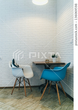 Peaceful artistic space. Calm artistic nook with natural lighting and flora. Serene creative corner designed with natural light and plant decorations for relaxation Peaceful artistic space. Calm artistic nook with natural lighting and flora. Serene creative corner designed with natural light and plant decorations for relaxation 136069598