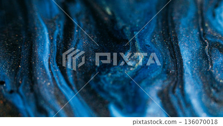 Paint flow. Blur shimmering drip. Blue black trickles spill with golden sparks. Wave acrylic pigment color mix abstract background. 136070018
