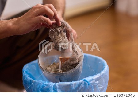 Deep cleaning process. Removing debris from filter meticulously. Detailed steps for effective lint elimination. Comprehensive guide to cleaning lint and dust from filters Deep cleaning process. Removing debris from filter meticulously. Detailed steps for effective lint elimination. Comprehensive guide to cleaning lint and dust from filters 136071049