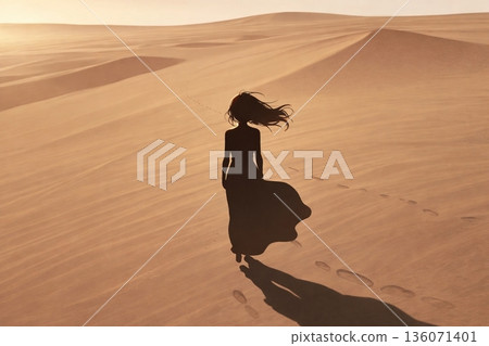 A woman wandering the desert, standing alone and dignified A woman wandering the desert, standing alone and dignified 136071401