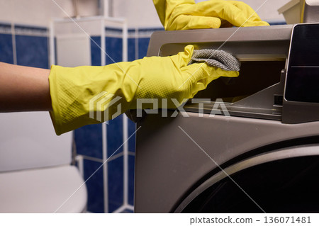 Using gloves to clean and protect gasket seals from mold, Thoroughly maintain gasket surfaces by sanitizing with cloth and hand wiping to prevent mold and moisture buildup Using gloves to clean and protect gasket seals from mold, Thoroughly maintain gasket surfaces by sanitizing with cloth and hand wiping to prevent mold and moisture buildup 136071481