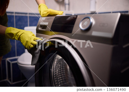 Using gloves to clean and protect gasket seals from mold, Thoroughly maintain gasket surfaces by sanitizing with cloth and hand wiping to prevent mold and moisture buildup 136071490