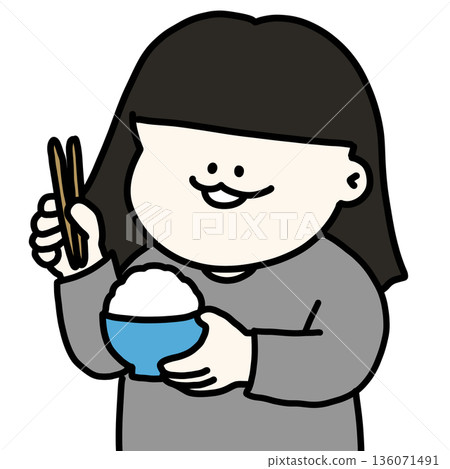 一個女孩手捧一碗飯和一雙筷子,津津有味地吃著。 一個女孩手捧一碗飯和一雙筷子,津津有味地吃著。 136071491