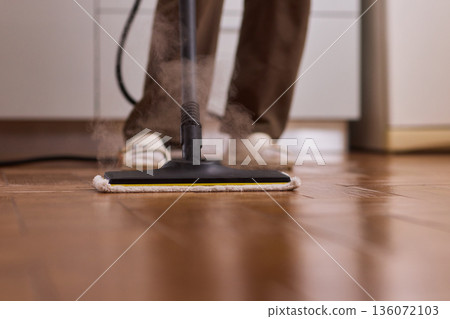 Professional parqueting cleaning visuals, Ecofriendly vapor cleaning for wooden floors, Scene showcasing deep cleaning technology with vapor and steaming effect on wooden flooring 136072103