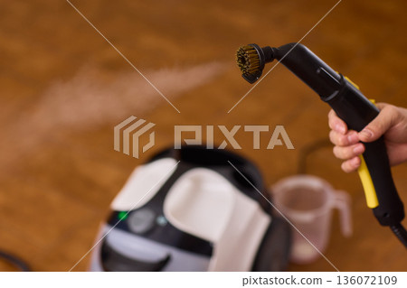 Hot vapor cleaning, Modern household cleaner using hot vapor for sanitization purposes, Device emits heated steam through brush to disinfect and refresh household surfaces Hot vapor cleaning, Modern household cleaner using hot vapor for sanitization purposes, Device emits heated steam through brush to disinfect and refresh household surfaces 136072109