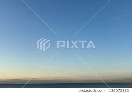 Clear blue morning sky and calm sea Clear blue morning sky and calm sea 136072183