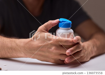 Pharmacist organizing medication bottles, Medical technician managing pill containers efficiently, Clinical staff ensuring proper storage and safety of pharmaceutical supplies Pharmacist organizing medication bottles, Medical technician managing pill containers efficiently, Clinical staff ensuring proper storage and safety of pharmaceutical supplies 136073558