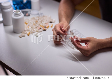 Cleaning and mixing medicines with precision craftsmanship, Detailed scene of meticulous drug processing involving tablet grinding and precise pharmaceutical handling 136073693