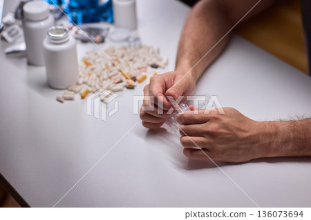 Cleaning and mixing medicines with precision craftsmanship, Detailed scene of meticulous drug processing involving tablet grinding and precise pharmaceutical handling 136073694