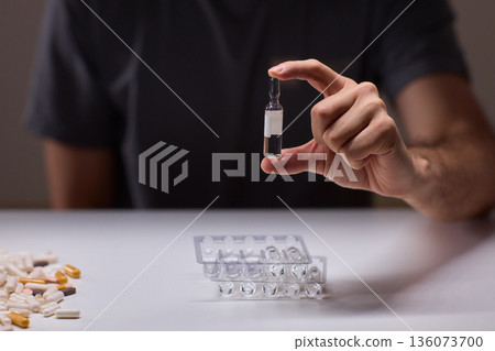 Cleaning and mixing medicines with precision craftsmanship, Detailed scene of meticulous drug processing involving tablet grinding and precise pharmaceutical handling 136073700