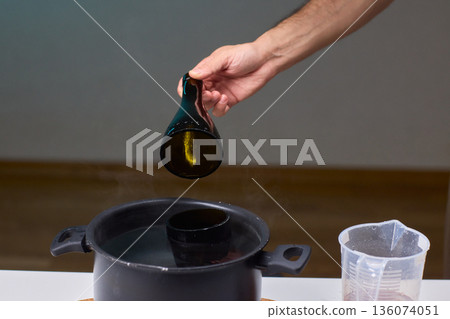 Precise technique for transforming bottles into functional decor pieces, Detailed method of utilizing heat and protective gear to repurpose glass containers into decorative items 136074051