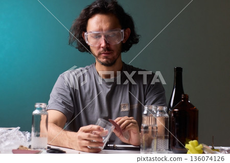 Safety Equipment Used During Glass Cutting, Workstation Setup for Safe Glass Shaping Procedure, Background of Workshop with Focus on Cutting Tools and Safety Precautions Safety Equipment Used During Glass Cutting, Workstation Setup for Safe Glass Shaping Procedure, Background of Workshop with Focus on Cutting Tools and Safety Precautions 136074126