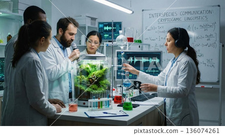 Diverse research team studying plant communication in a modern lab. Biotechnology concept Diverse research team studying plant communication in a modern lab. Biotechnology concept 136074261