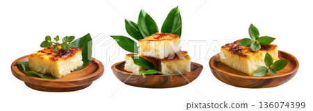 Cassava syrup-drenched semolina coconut cake pieces stacked and isolated on white background, concept of Fijian Cuisine Cassava syrup-drenched semolina coconut cake pieces stacked and isolated on white background, concept of Fijian Cuisine 136074399