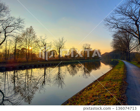 Rijkevorsel, Antwerpse Kempen, Belgium, Gentle morning light reflects on peaceful water surface 136074713