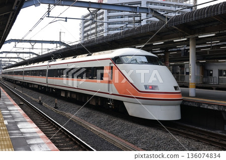 Tobu Limited Express Spacia train passing through JR Akabane Station 136074834