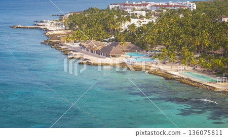Aerial shot of a sandy beach and Caribbean Sea background exclusive resort Aerial shot of a sandy beach and Caribbean Sea background exclusive resort 136075811