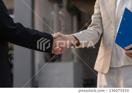 Business women shake hands after agreeing to start a new project successfully. Business women shake hands after agreeing to start a new project successfully. 136075830