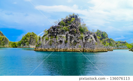 beautiful view of island and sea with clear sky background, West Papua, Indonesia 136076113