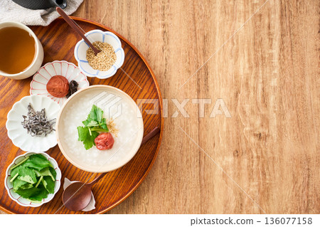 Warm white rice porridge with pickled plum and mitsuba Warm white rice porridge with pickled plum and mitsuba 136077158