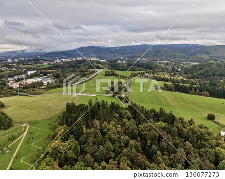 Expansive Green Fields And Woods, Open Rural Scenery Featuring Dense Woodlands And Winding Footpaths 136077273