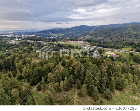 Mixed Forest Hills With Village Scene, Elevated Woodland Hills Gazing Upon Quaint Town And Farmland Mixed Forest Hills With Village Scene, Elevated Woodland Hills Gazing Upon Quaint Town And Farmland 136077286