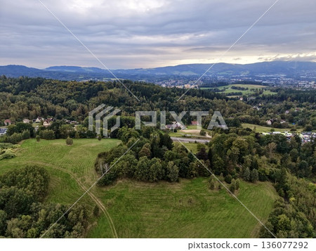 Serene Rural Areas Meet City Outskirts, Peaceful Farmlands Stretch Toward Distant City Skyline Serene Rural Areas Meet City Outskirts, Peaceful Farmlands Stretch Toward Distant City Skyline 136077292